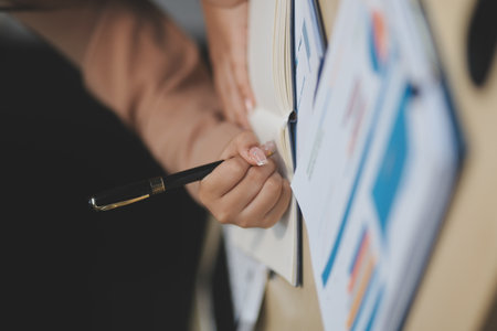 business documents businessman check legal document review Prepare documents or analysis reports, tax items, accounting documents, data contracts, office partner agreements.の写真素材