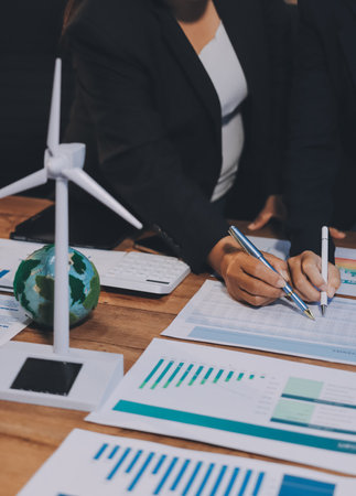 Carbon offset price report CO2 emission. Future growth Net zero waste in ESG ethical SME office protect climate change global warming social issues project. Group of asia people Eco friendly SDGs planの写真素材