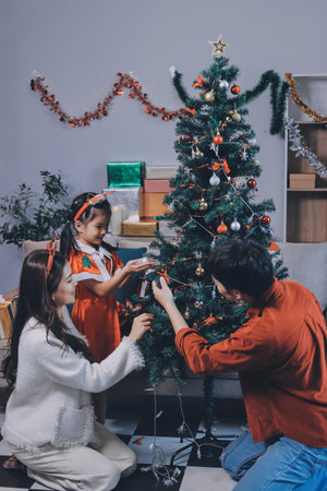 Father, mother and child celebrating Christmas.の写真素材
