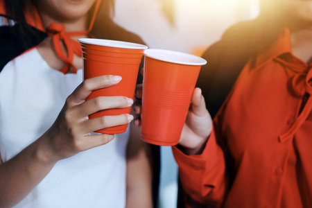 friendship, holiday and people concept - group of happy smiling friends in halloween costumes of vampire, devil, witch and cheetah at home partyの写真素材