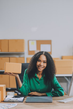 Portrait of Starting small businesses SME owners female entrepreneurs working on receipt box and check online orders to prepare to pack the boxes, sell to customers, SME business ideas online.の写真素材