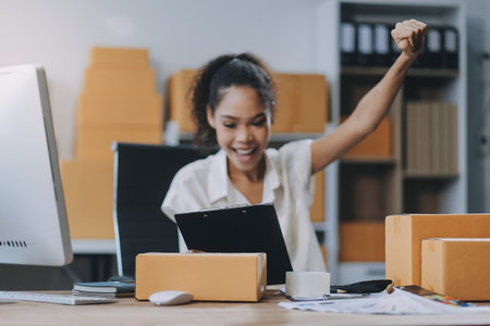 Portrait of Starting small businesses SME owners female entrepreneurs working on receipt box and check online orders to prepare to pack the boxes, sell to customers, SME business ideas online.の写真素材