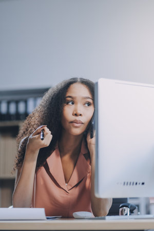 Young business woman entrepreneur using laptop and mobile phone at the working space.の写真素材