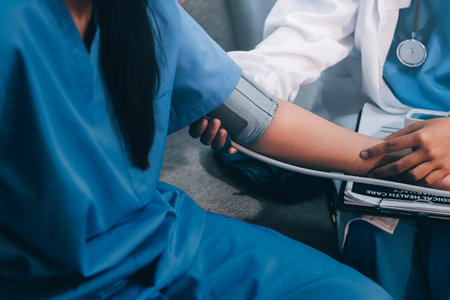 The doctor woman hand use the pulse meter to measure the pressure of the patient, medical checkup concept.の写真素材