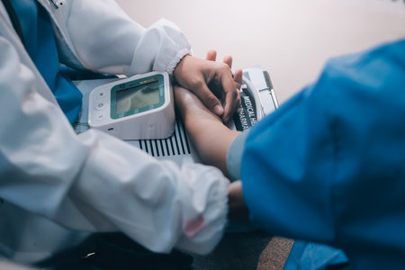 The doctor woman hand use the pulse meter to measure the pressure of the patient, medical checkup concept.の写真素材