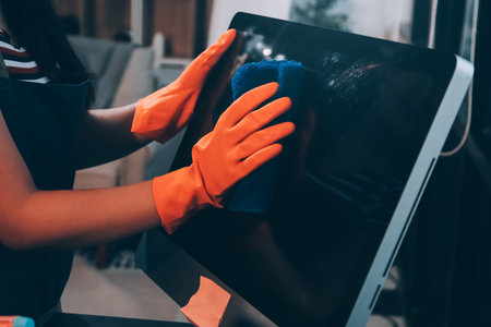 Janitor wiping table in officeの写真素材