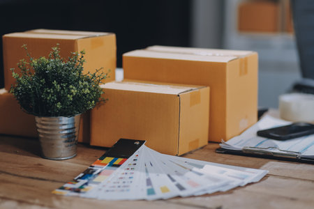 Portrait of Starting small businesses SME owners female entrepreneurs working on receipt box and check online orders to prepare to pack the boxes, sell to customers, SME business ideas online.の写真素材