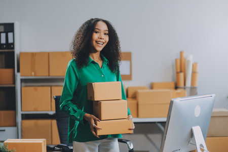 Portrait of Starting small businesses SME owners female entrepreneurs working on receipt box and check online orders to prepare to pack the boxes, sell to customers, SME business ideas online.の写真素材