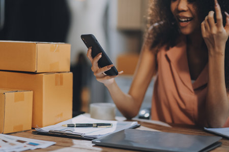 Portrait of Starting small businesses SME owners female entrepreneurs working on receipt box and check online orders to prepare to pack the boxes, sell to customers, SME business ideas online.の写真素材