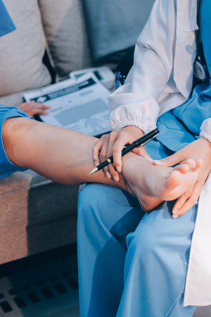Doctor giving a patient a leg treatment