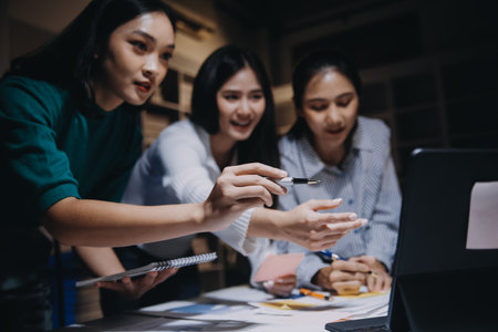 Group of young asian creative business brain storm meeting presentation,discussing roadmap to product launch, planning,strategy,new business development,working with new startup project in office.の写真素材