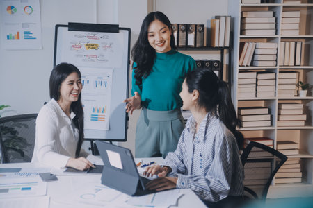 Group of young asian creative business brain storm meeting presentation, discussing roadmap to product launch, planning, strategy, new business development, working with new startup project in office.の写真素材