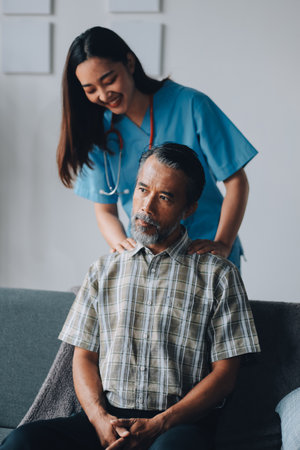 Female Physical Therapist Examines the Patient's Neckの写真素材