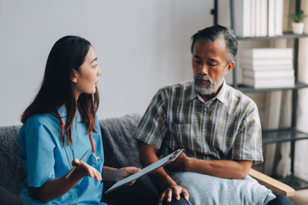 Men's health exam with doctor or psychiatrist working with patient having consultation on diagnostic examination on male disease or mental illness in medical clinic or hospital mental health serviceの写真素材