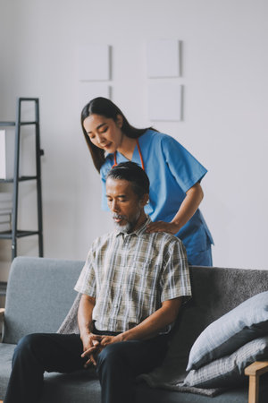 Female Physical Therapist Examines the Patient's Neckの写真素材
