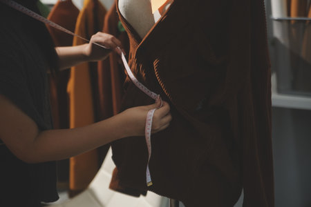 Fashion designers at work. beautiful young woman working in fashion design studio.