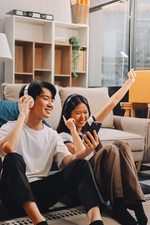 Smiling couple unpacking boxes in new houseの写真素材