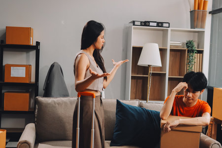 Young Asian married couple after a fight, Angry couple ignoring each other, relationship troubles.の写真素材