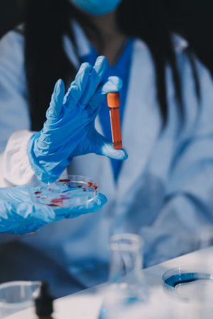 Microbiological research with a test tube and micropipette in close -upの写真素材