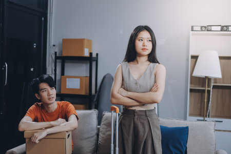 Stressed young married family couple arguing, blaming each otherの写真素材