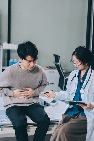 Female physician reads medical history while visiting her patient
