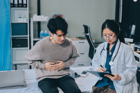 Female physician reads medical history while visiting her patient