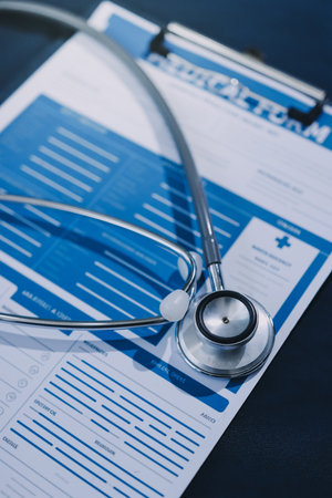 stethoscope on a report stethoscope on a clipboard stethoscope on a bookの写真素材