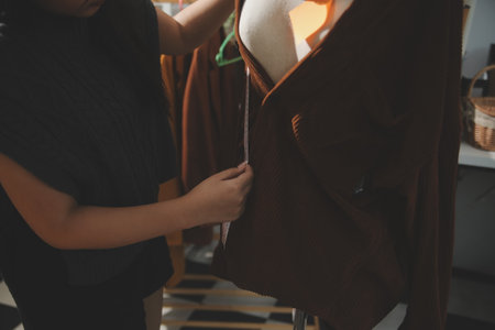 Fashion designers at work. beautiful young woman working in fashion design studio.の写真素材