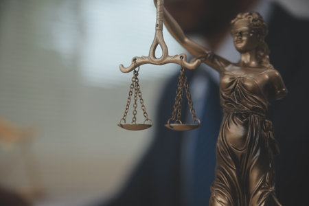 Judge gavel and miniature car symbolize auction or court case against driver who has accident and...