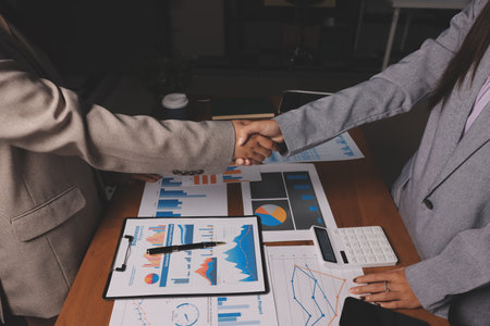 Business handshake for teamwork of business merger and acquisition,successful negotiate,hand shake,two businessman shake hand with partner to celebration partnership and business deal conceptの写真素材