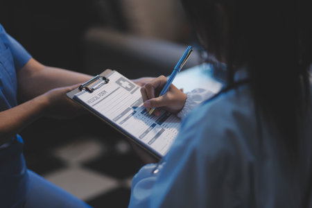 Charming female doctor giving advice to a female patient.の写真素材