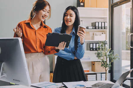 Entrepreneurs and business people in modern meeting room, happy multiracial coworkers have fun cooperating working together at office meeting, asian teamwork conceptの写真素材