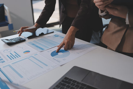 Accounting company provide finance and taxation planning for profitable cash flow, Auditor and accountant team working in office, analyze financial data and accounting record with calculator.Insightの写真素材
