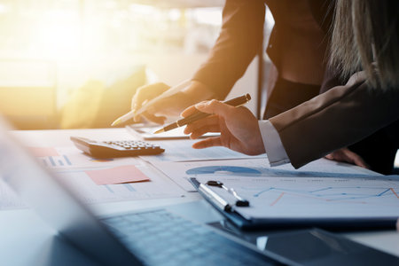 Accounting company provide finance and taxation planning for profitable cash flow, Auditor and accountant team working in office, analyze financial data and accounting record with calculator.Insightの写真素材