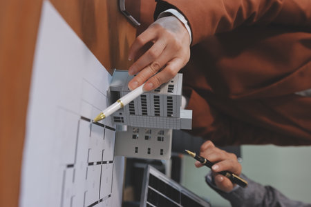 Discussion among businesspeople on the latest developments in solar cell panel technology and solar energy environment.の写真素材