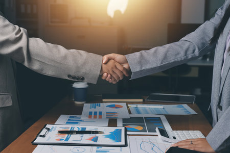 Business handshake for teamwork of business merger and acquisition,successful negotiate,hand shake,two businessman shake hand with partner to celebration partnership and business deal conceptの写真素材