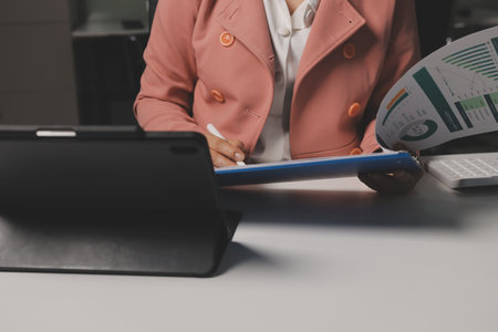 Cropped image of professional businesswoman working at her office via laptop, young female manager...
