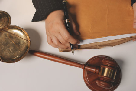 Judge gavel with Justice lawyers having team meeting at law firm background. Concepts of Law and...