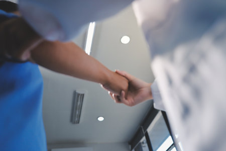 Orthopedist examining patient in hospital