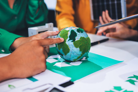 Young Asian business team discussion reusable product in office,start up eco-friendly business,environmental protection,sustainable business model,ESG strategy,team meeting,people work at home conceptの写真素材