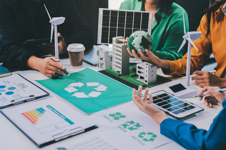 Young Asian business team discussion reusable product in office,start up eco-friendly business,environmental protection,sustainable business model,ESG strategy,team meeting,people work at home conceptの写真素材
