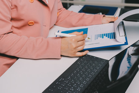 Cropped image of professional businesswoman working at her office via laptop, young female manager...