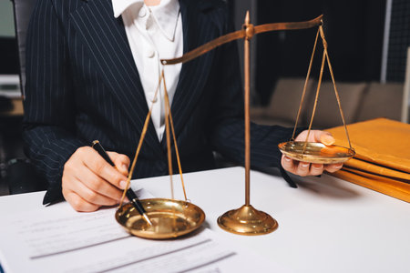 Judge gavel with Justice lawyers having team meeting at law firm background. Concepts of Law and Legal services.の写真素材