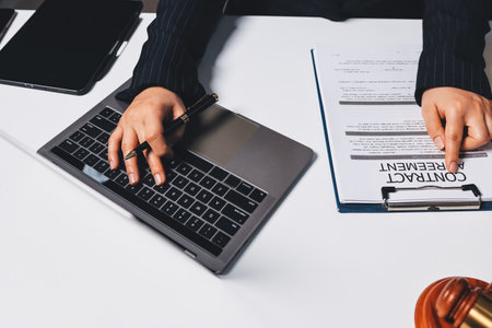 Judge gavel with Justice lawyers having team meeting at law firm background. Concepts of Law and Legal services.の写真素材