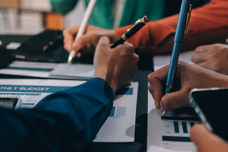 Business Team Analyzing Financial Data in Modern Office