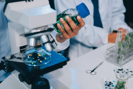 Hands, plant scientist and laboratory test tubes in plant growth research, climate change solution...