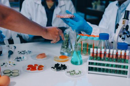 Hands, plant scientist and laboratory test tubes in plant growth research, climate change solution...