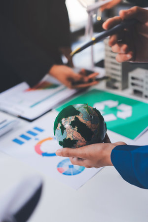 Young Asian business team discussion reusable product in office,start up eco-friendly business,environmental protection,sustainable business model,ESG strategy,team meeting,people work at home conceptの写真素材