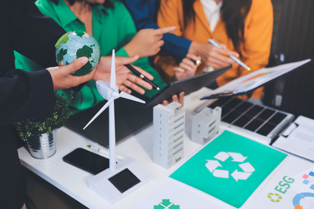 Young Asian business team discussion reusable product in office,start up eco-friendly business,environmental protection,sustainable business model,ESG strategy,team meeting,people work at home conceptの写真素材