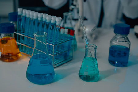 Chemists in a lab developing cosmetic products, testing and analyzing formulas for quality and...